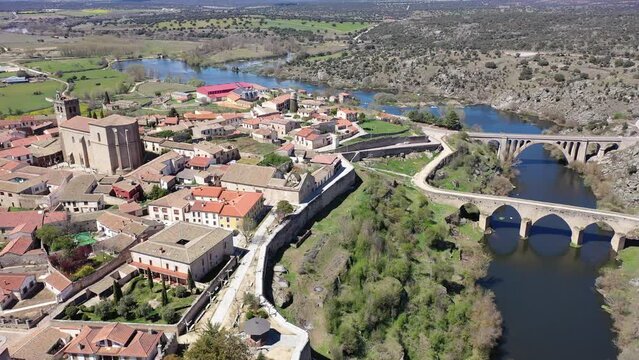Scenic aerial cityscape of Ledesma town and Tormes river at spring, Salamanca region, western Spain