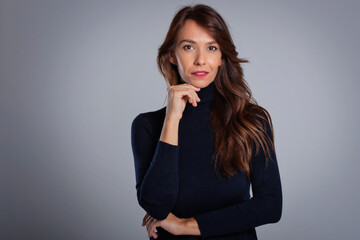 Close-up studio portrait of attractive middle aged woman