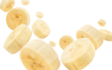 Flying banana slices, isolated on white background