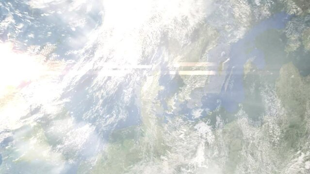 Earth zoom in from outer space to city. Zooming on Randers, Denmark. The animation continues by zoom out through clouds and atmosphere into space. Images from NASA