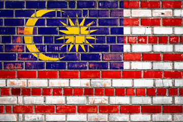 National  flag of the  Malaysia on a grunge brick background.