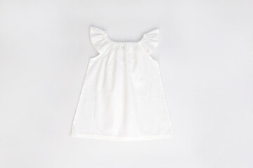 Mockup of white baby cotton dress on white background. Layout mock up ready for your design...