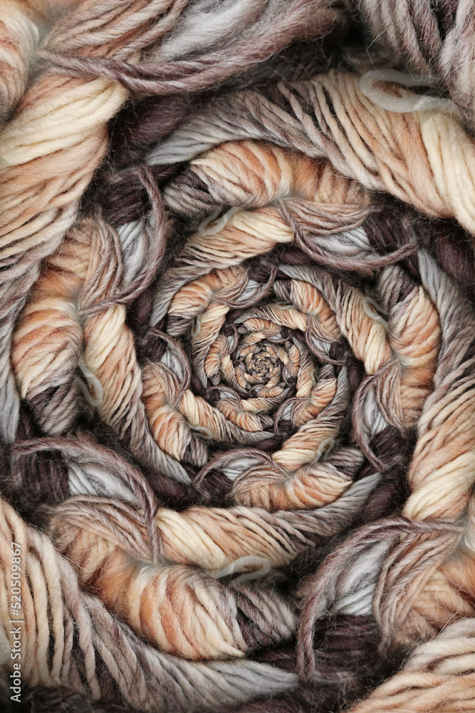 Poster ball of coloured wool making a complex design structure on black background