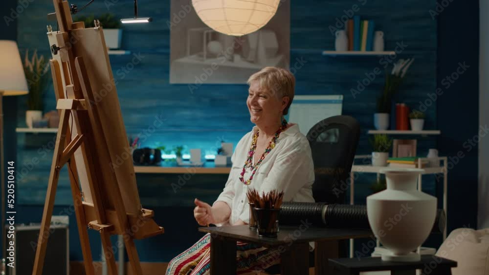 Aufkleber senior artist creating authentic sketch with pencils on canvas, using inspiration model for artistic