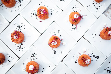 Salmon roll served at a wedding buffet. Finger food served on a white background - obrazy, fototapety, plakaty