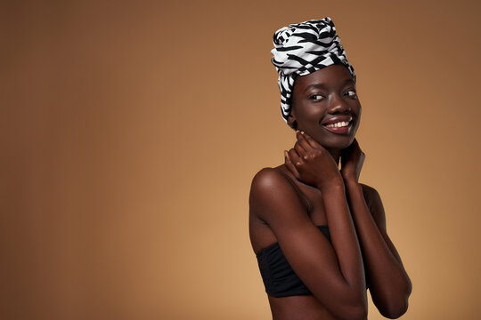 Girl wear traditional african turban look away