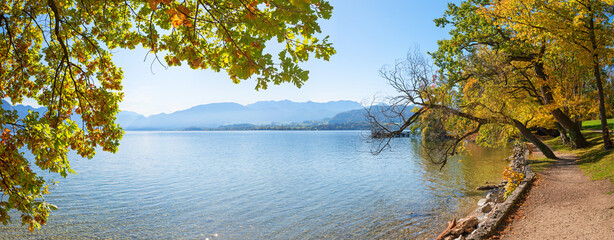 toscanapark Gmunden, lake Traunsee, autumnal colored trees at the lakeside. austrian landscape panorama