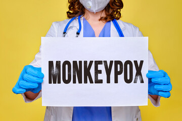 Doctor and inscription monkeypox virus, quarantine due to disease pandemic. Nurse and text monkey...