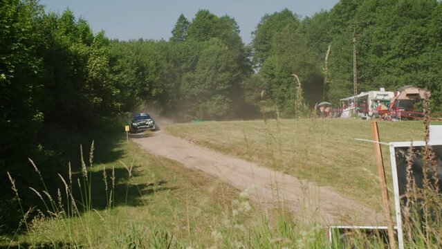 Racing car driving towards the camera slow motion