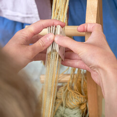 An ancient Roman woman makes yarn and sews from vintage wool. Reconstruction of the events of the...