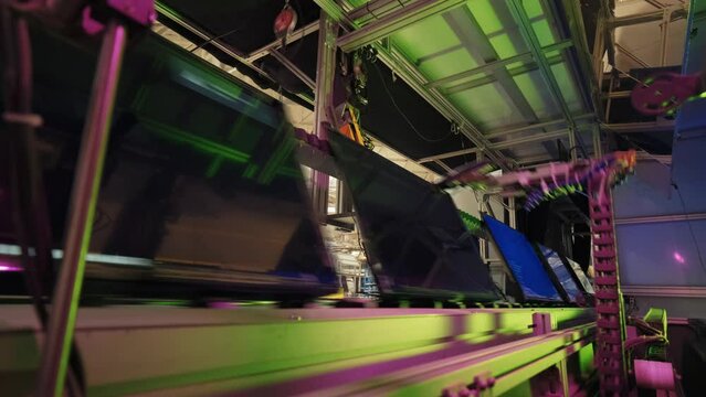 Robotic technology of Electronic Led Board TV Factory.TV LEDS in electronics production line on modern factory. 4K