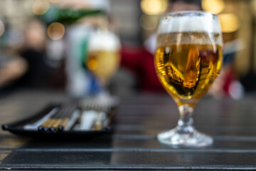 Two glasses of beer over the sidewalk table. Budapest, Hungary