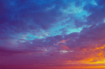 Naklejka na ściany i meble Dramatic colorful cloudy sky at sunset