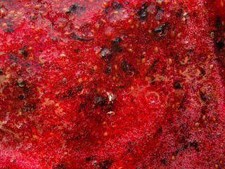 Black currant jam. Dark Red Berry Jam Flat Background. wild berries jam. Red abstract background.