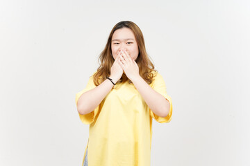 Covering mouth and laugh of Beautiful Asian Woman wearing yellow T-Shirt Isolated On White