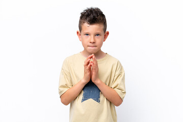 Little caucasian boy isolated on white background scheming something