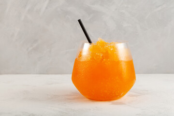 Orange Slushie drink. Sweet Shaved ice. Spanish fruit granizado. Refreshing summer iced drink