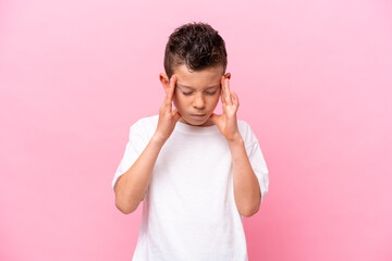 Fototapeta premium Little caucasian boy isolated on pink background with headache