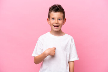 Little caucasian boy isolated on pink background with surprise facial expression
