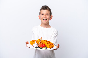 Little caucasian boy holding a waffles isolated on white background