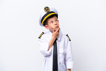 Little airplane pilot boy isolated on white background having doubts