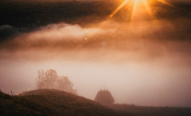 Naklejka na ściany i meble beautiful foggy autumn morning landscape in rural Transylvania