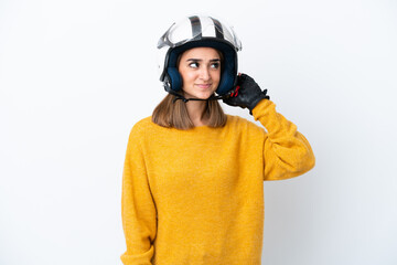 Young caucasian woman with a motorcycle helmet isolated on white background having doubts