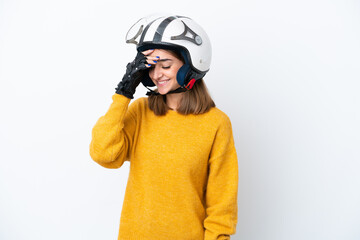 Young caucasian woman with a motorcycle helmet isolated on white background laughing