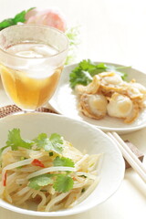 Asian food, scallop and garlic stir fried served with soy sprout