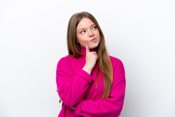 Young caucasian woman isolated on white background having doubts while looking up