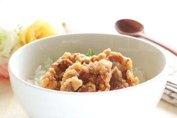 Fried chicken and lettuce on rice for Asian lunch meal image
