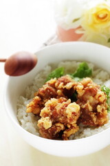 Fried chicken and lettuce on rice for Asian lunch meal image