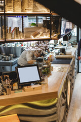 Pan-Asian cafe interior, bar counter with crockery