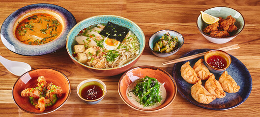 Set of assorted pan asian dishes. Chinese, Korean, Japanese cuisine. Soups, dumplings, noodles, rice and desserts.