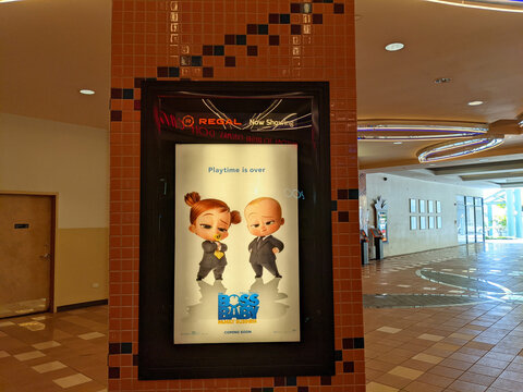 Boss Baby: Family Business Movie Poster featuring Alec Baldwin outside inside Regal Theater