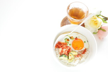 Korean food, deep fried zucchini and Kimchi with sunny side up fried egg on rice