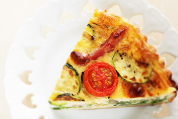 Homemade zucchini and cherry tomato with bacon quiche