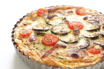 Homemade zucchini and cherry tomato with bacon quiche