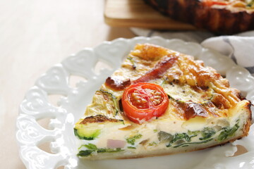 Homemade zucchini and cherry tomato with bacon quiche