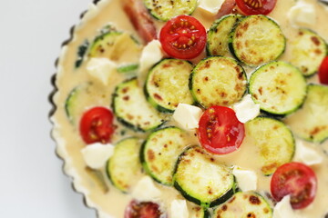 Prepared egg and pan fried zucchini in egg wash for  quiche cooking ingredient