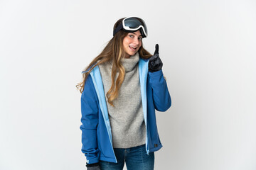 Skier girl with snowboarding glasses isolated on white background showing and lifting a finger in sign of the best