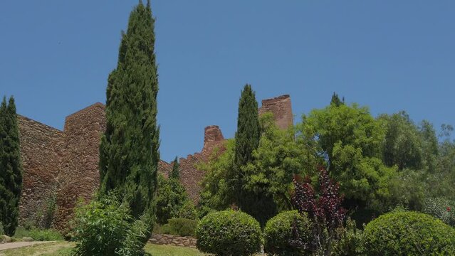 View of The Alcazaba a palatial fortification in M&aacute;laga at Midday, Spain - Islamic heritage sites  in Andalusia. 