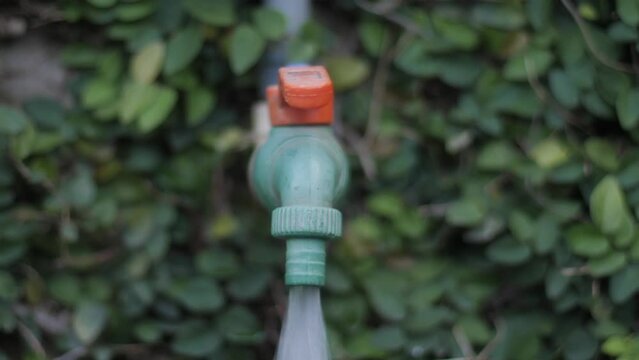 A man opening Running tap