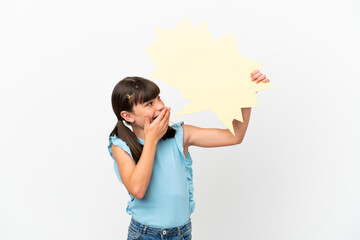 Little caucasian kid isolated on white background holding an empty speech bubble with surprised expression