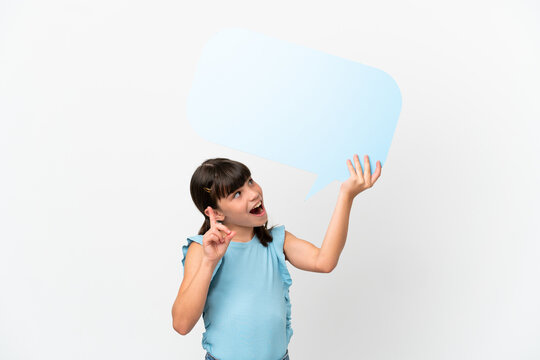 Little caucasian kid isolated on white background holding an empty speech bubble and thinking