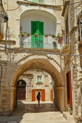 Narrow street in the historic center of Molfetta, a village in the Puglia region, Italy