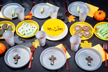 Halloween sweet appetizer kids table setting concept