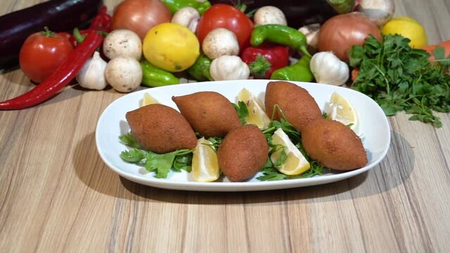 Turkish kibbeh on a serving plate.
Kibbeh, traditional Turkish dish

