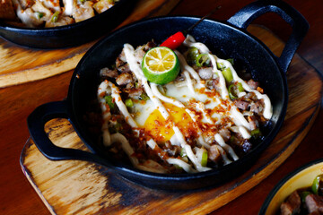 Freshly made Filipino food called Pork Sisig or chopped pork