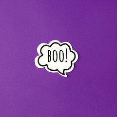 Halloween paper decorations chat bubble boo mock up on purple background. Flat lay, top view, minimal style, copy space, banner for your site, party invitation, flyer, traditional color